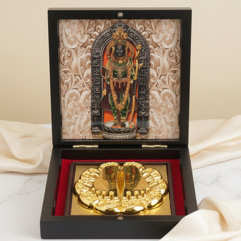 Decorative item with a gold emblem and an ornate cover on a light background