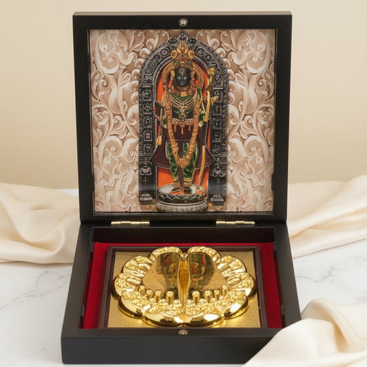 Decorative item with a gold emblem and an ornate cover on a light background